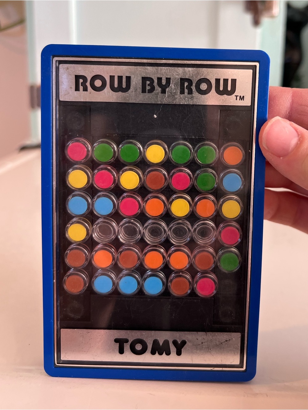Row By Row Handheld Puzzle TOMY Game - Blue Frame